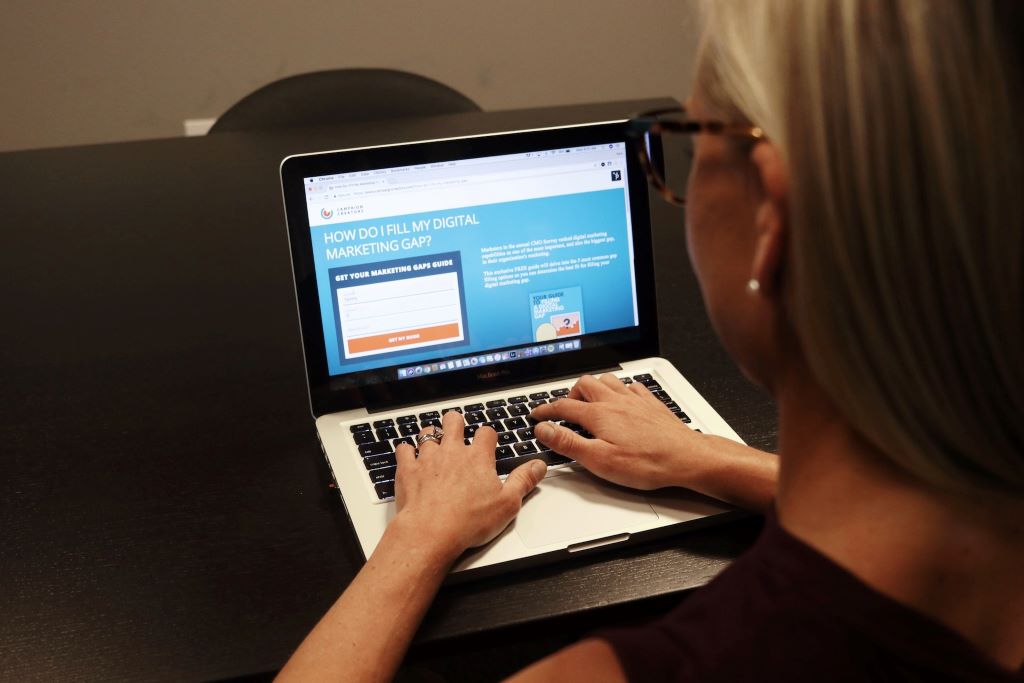 Person planning and managing a digital business from home workspace